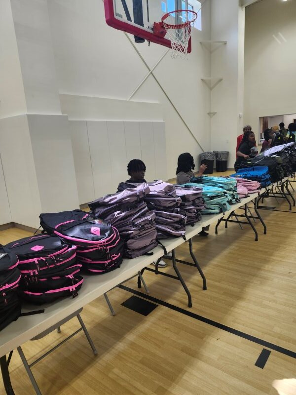 Backpacks sitting on a table.